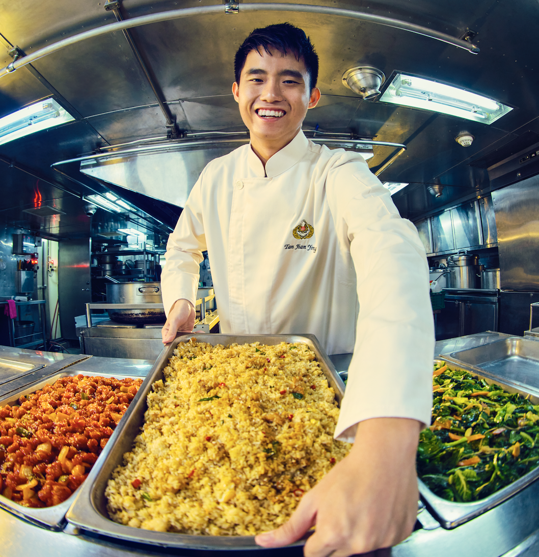 RSN chef in uniform serving freshly cooked meals
